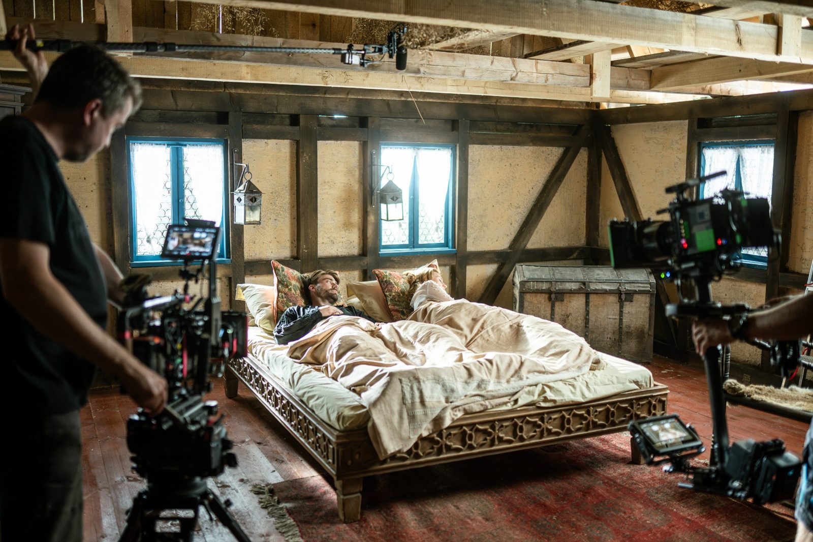 Film crew shooting a bedroom scene in the dressed interior of The Mill