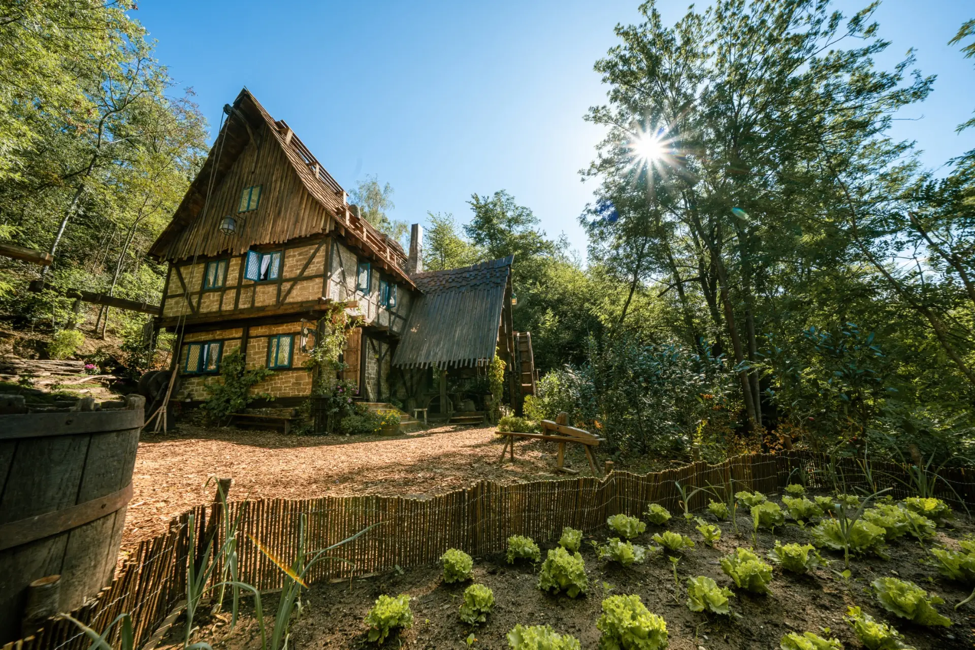 Wide exterior production view of The Mill and practical garden