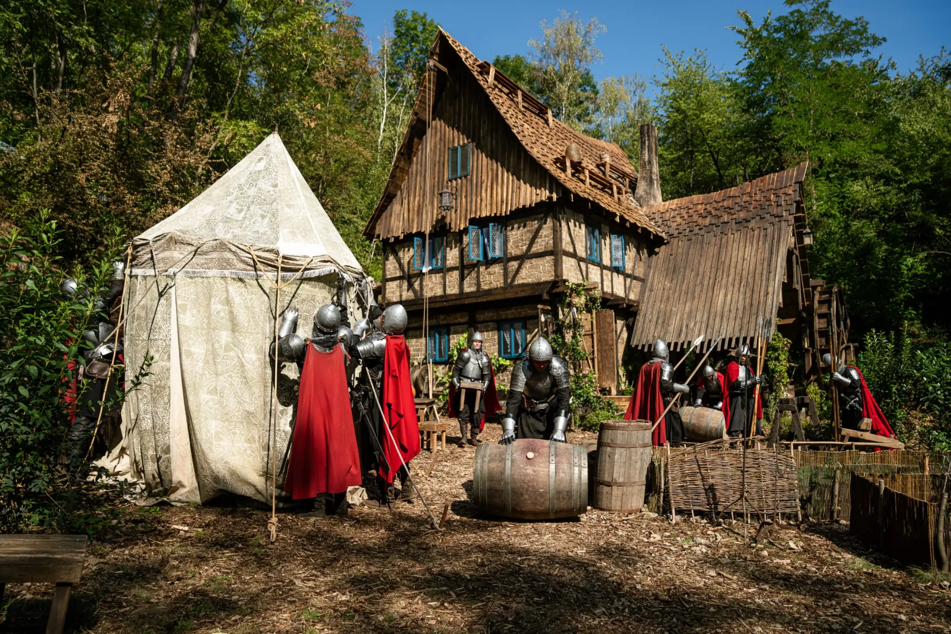 Costumed performers and dressed scenery outside The Mill